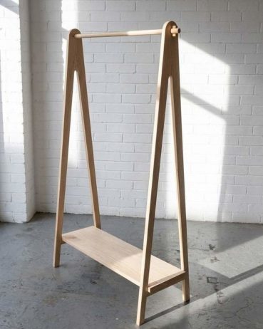 Contemporary solid Ash clothing rail in a workshop with natural light. Designed and made by Birbeck Furniture.