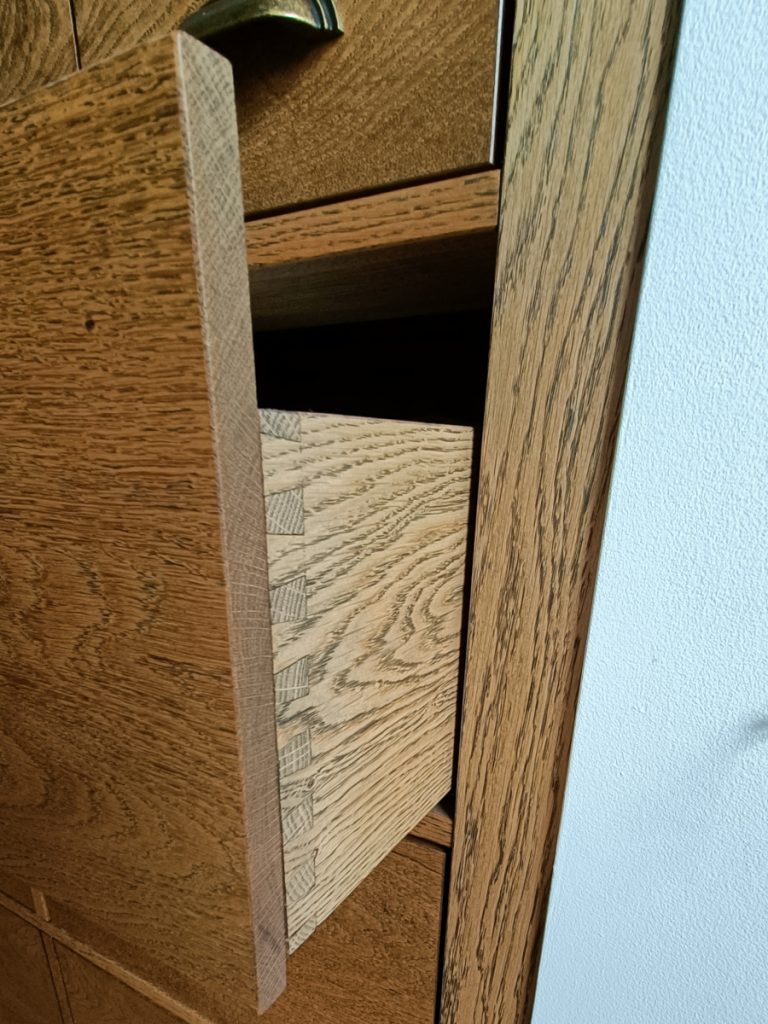 Detail of the solid oak drawer, showing the dovetail joints
