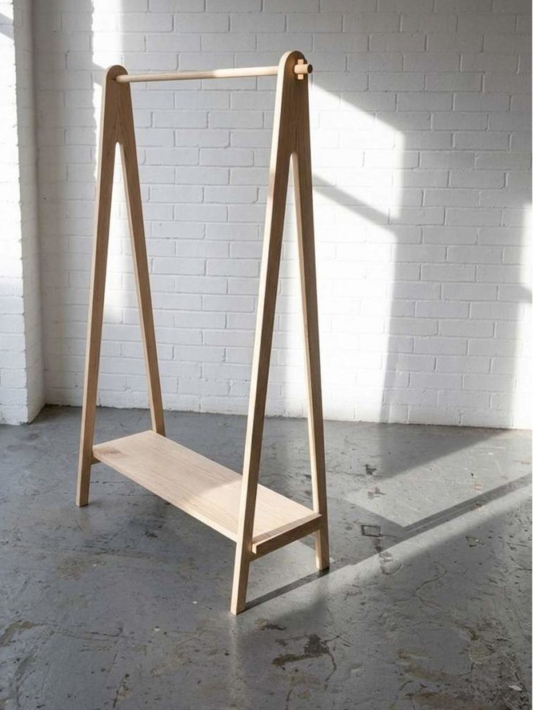 Contemporary solid Ash clothing rail in a workshop with natural light. Designed and made by Birbeck Furniture.